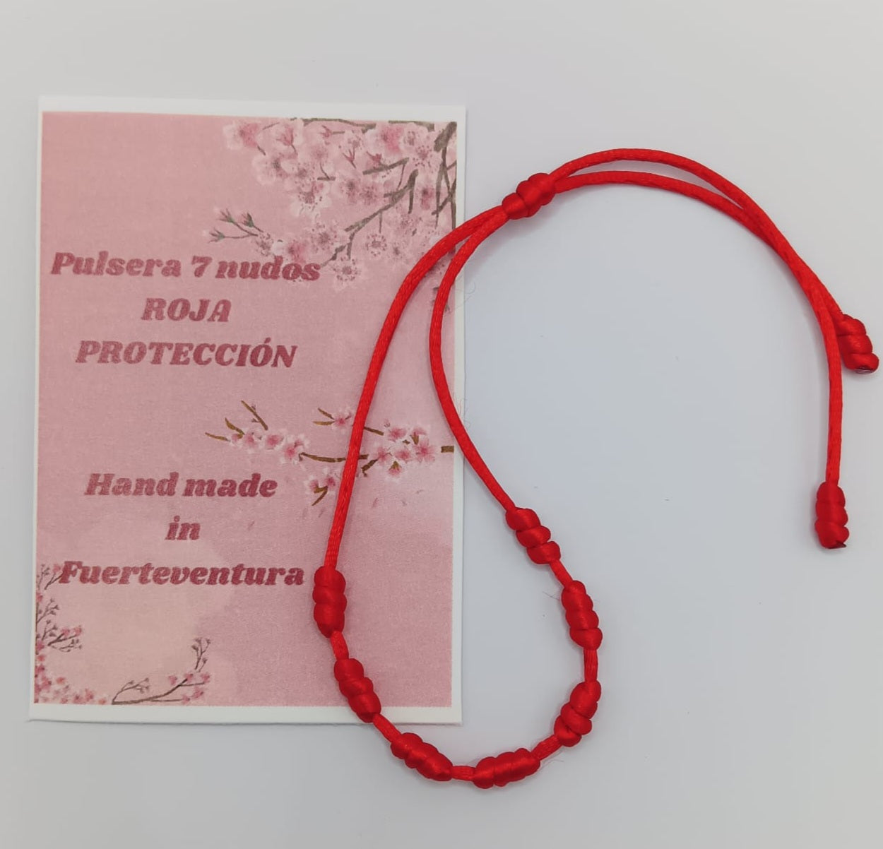 Pulsera hilo siete nudos roja