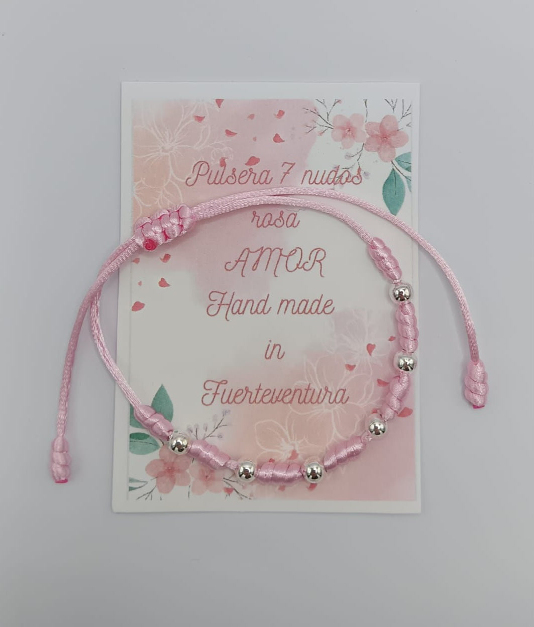 Pulsera hilo siete nudos rosa